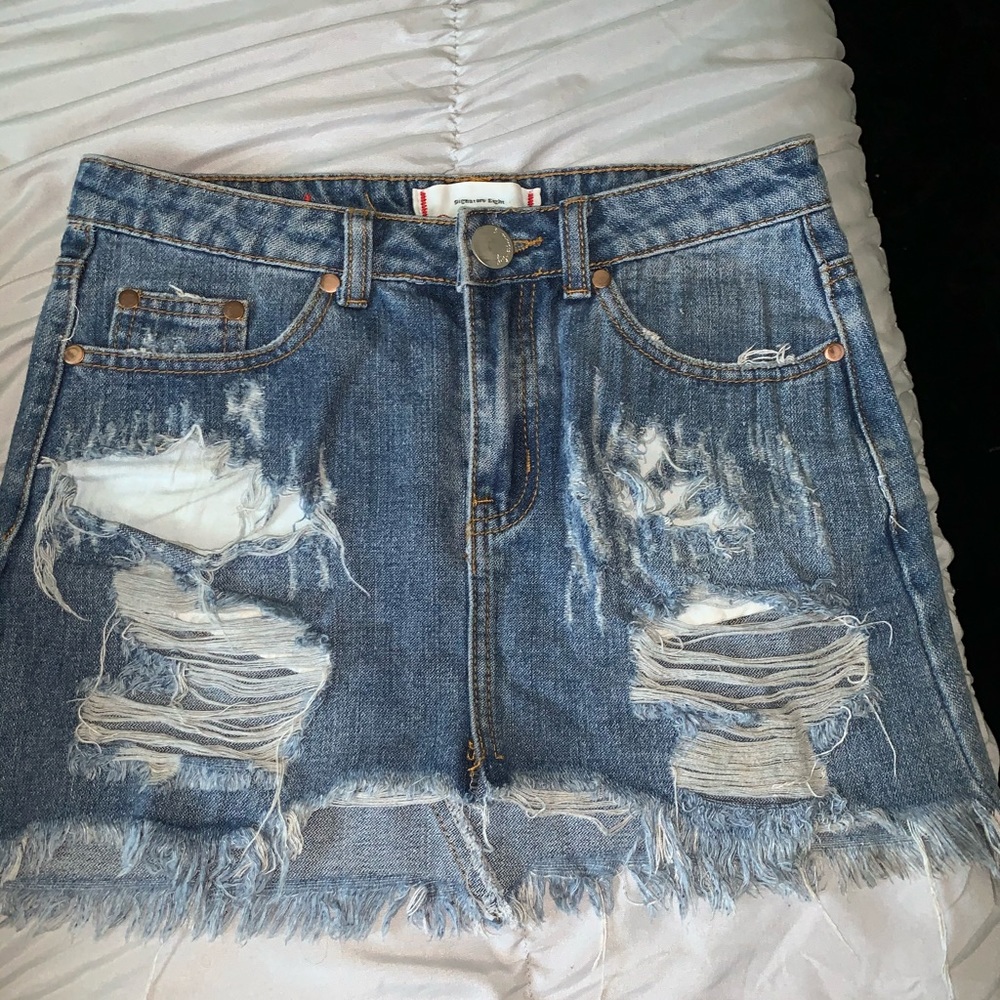 Distressed jean skirt trendy